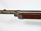 a close up of a rifle on a white background