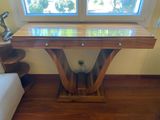 a wooden table with a glass top in a living room
