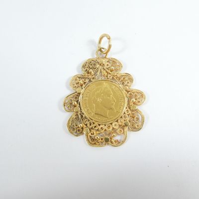 a close up of a gold coin on a white surface