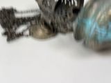 a close up of a metal object on a white surface