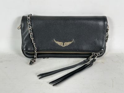 a black leather purse with a gold wing on it