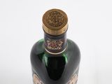 a bottle of liquor that is sitting on a table