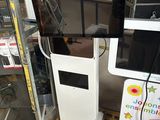 two televisions sitting on top of a pallet in a store