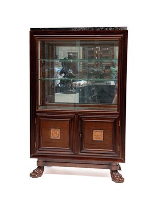 a display cabinet with a glass door and a wooden base