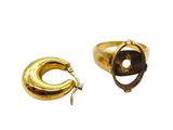 an image of a pair of gold rings with a stone in the middle