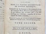 an old book that is open on a table
