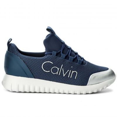 a close up of a pair of shoes with the word calvin on it
