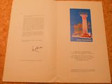an open book with a picture of a building on it