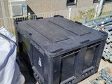 a lot of garbage on the ground outside of a building