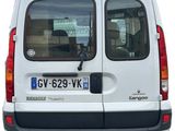 rear view of a white van with a license plate on the back of it