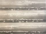 a black and white photo of a group of icebergs in the water