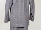 an image of a suit on a mannequin stand