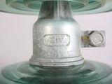 a close up of a green glass light on a table