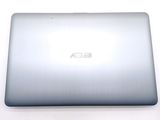 a silver laptop sitting on top of a white table