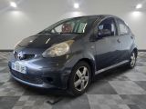 a picture of a small car parked in a garage