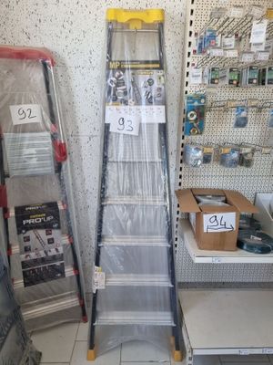 a lot of shelves in a store that have various items on them