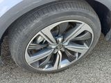 a close up of a tire on a car ' s rim