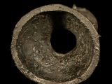 a close up of a metal pipe on a black background