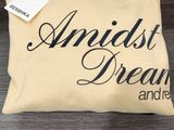 a pillow that has a tag on it that says angist dreams and dreams