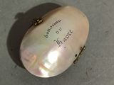 a white shell with writing on it sitting on a table