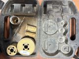 a box with some tools inside of it on a table