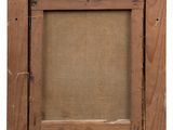 an old wooden picture frame with a label on it