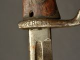 a close up of a knife with a metal handle