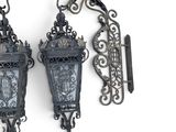 two wall lights that are hanging on the wall