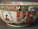 a bowl that has a picture of a woman and a dog on it