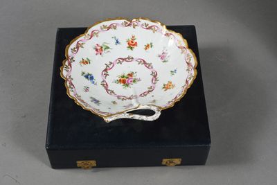 a close up of a plate on a box with a handle