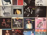 a lot of records on the wall of a room