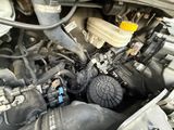 a close up of a car ' s engine with the hood open