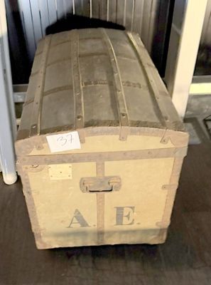 a large wooden box sitting on the floor in a room