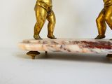 two figurines of a man and a woman on a skateboard