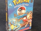 a box of pokemon cards sitting on a table