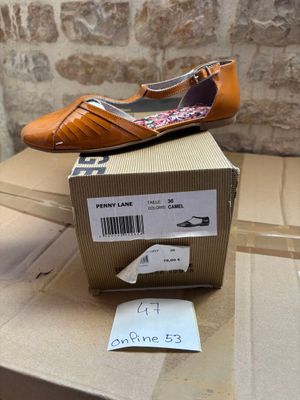 a box with a pair of shoes on top of it