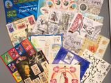 a lot of postcards that are on top of a table