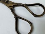a close up of a pair of scissors on a table