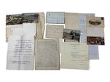 several old papers and letters are stacked on top of each other