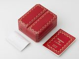 two red boxes with gold designs on them sitting on a white surface