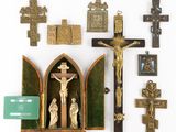 many religious items displayed on a white surface