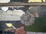 reflection of a man holding a knife in front of a mirror