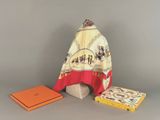 an image of a scarf and two books on a table
