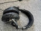 a pair of black headphones laying on the ground