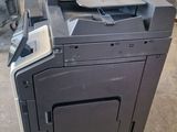 the printer is sitting on top of the cart in the warehouse