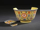yellow and blue bowl with floral design and a spoon in the middle