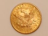 an image of a gold coin on a white surface