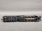 a toy train on a gray surface with a gray background
