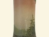 a vase that is sitting on a stand on a table