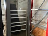 an image of a glass door refrigerator in a warehouse